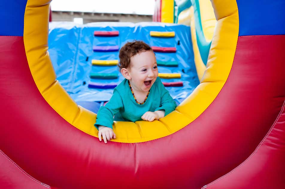 Child in bounce house